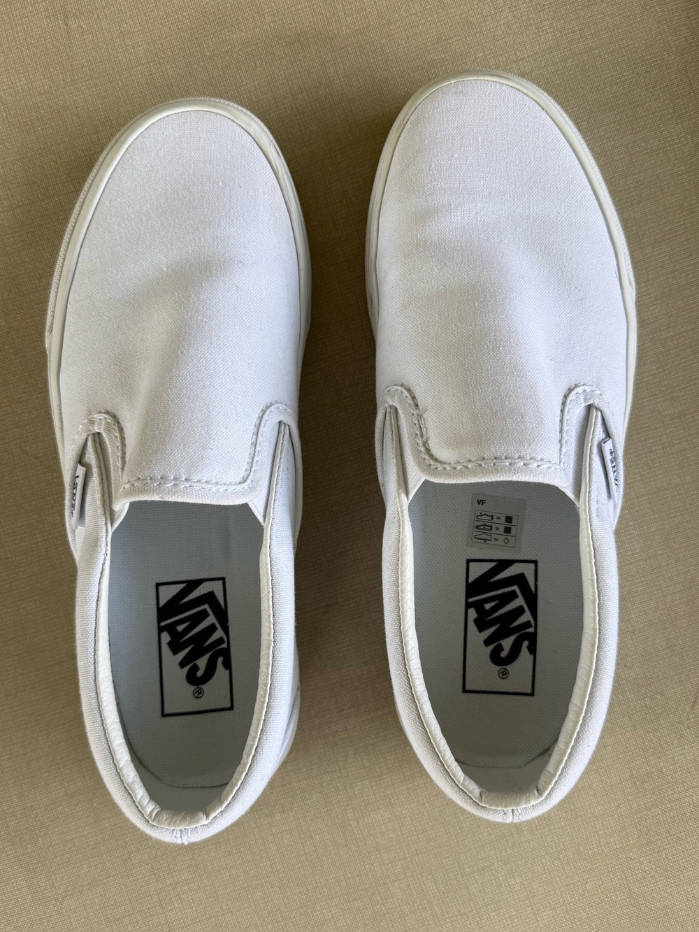 Vans White Canvas Slip-On Sneakers